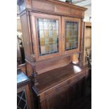 Early C20th Dutch side cabinet with moulded cornice above pair of coloured lead glazed doors, base