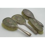 Geo.V hallmarked sterling silver mounted dressing table set comprising hand mirror, clothes brush