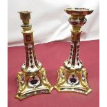 Pair of Royal Crown Derby Imari 1128 pattern candlesticks, raised on square spreading bases with