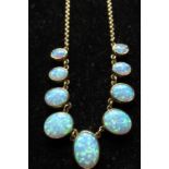 9ct yellow gold and opal necklace, nine graduated oval opal beads inset in linked 9ct yellow gold