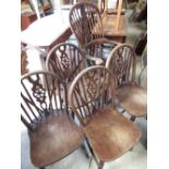 C19th ash and elm high back Windsor chair, H115cm and a set of four wheel back dining chairs (5)