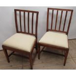 Pair of C19th mahogany dining chairs, with railed splats and drop in seats on square supports (2)