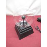 Contemporary plasma ball on stepped black base, overall H33cm