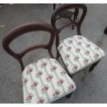 Pair of Victorian mahogany framed balloon back dining chairs, florentine woolwork seats on lobed