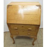 Small C20th light oak bureau, fall front above two drawers on cabriole legs, W59cm D40cm H100cm