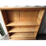 Pine open bookcase, with three adjustable shelves on a plinth base W103cm D25cm H120cm