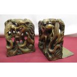 Pair of early C20th Chinese box wood book ends in form of dragons with gilt and painted