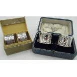 Pair of Geo.V hallmarked sterling silver napkin rings with repousse wreath and initialled R, by