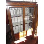 Edwardian inlaid mahogany display cabinet with lead glazed doors, on square tapered supports,