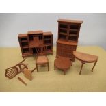 Craftsman made mahogany miniature dolls house furniture comprising a Georgian style bookcase,