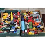 A large collection of toy trucks, cars and buses by Dinky and Corgi, including a Dinky Bedford,
