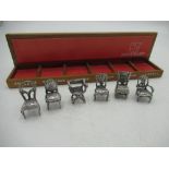 Set of six continental sterling silver miniature period chairs with a small display shelf 1.83ozt