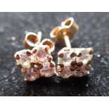 Pair of diamond earring studs, four round cut diamonds claw set on yellow metal mounts, gross 0.9g