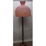 Geo. III style walnut standard lamp with fluted column, with pink fringed shade on stepped