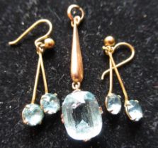 Pair of 9ct yellow gold drop pendant earrings with claw set blue stones and a 9ct yellow gold