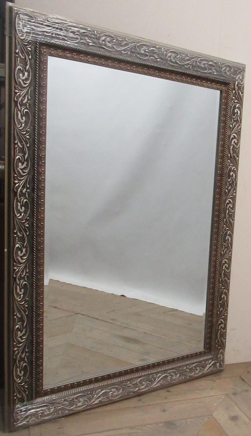 Victorian style wall mirror in Champagne scroll moulded frame, 103cm x 74cm