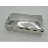 Geo.V hallmarked sterling silver cigarette box with fourteen engraved initials to lid by Charles S