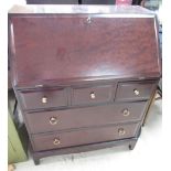 Stag Minstrel bureau, slope front with inset writing surface above three short and two long