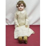 Armand Marseille stamped A 370 AM-I-DEP, wearing brown wig, crochet dress, H52cm