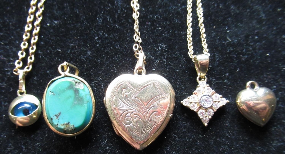 9ct yellow gold bright cut heart shaped locket, on a link chain necklace, another with an eye