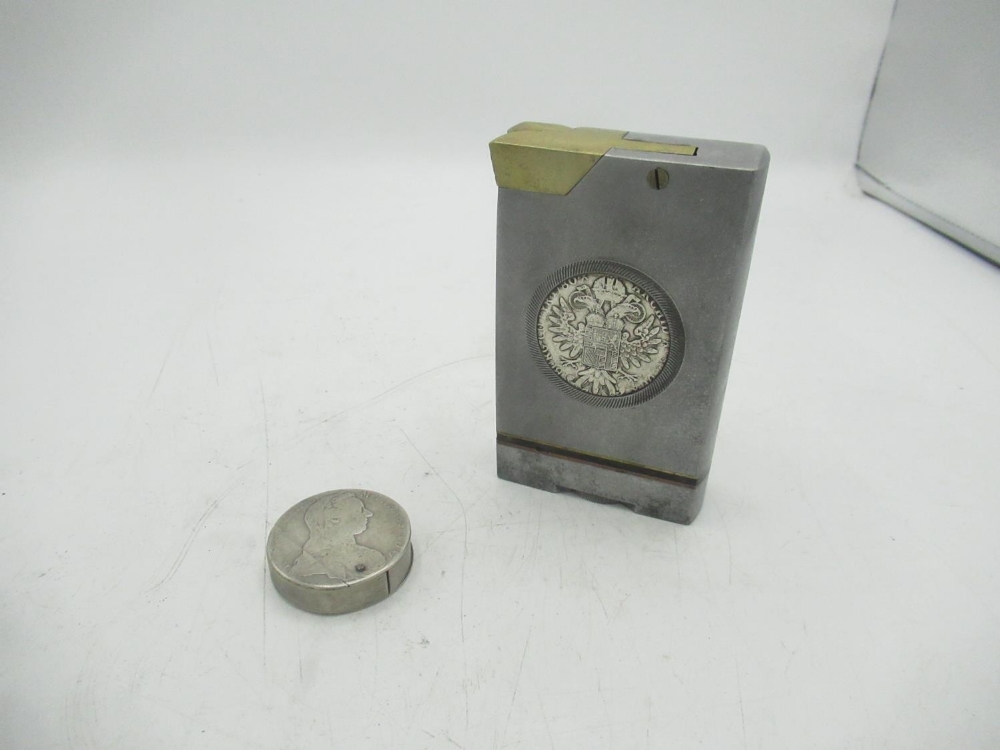 Large metal lighter with Maria Theresa coin encased and a circular Maria Theresa coin lighter (2)