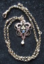 9ct yellow gold openwork pendant set with seed pearls and a claw set blue stone on a 9ct yellow gold
