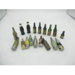 Six miniature Guinness bottle lighters, 2 Coca-Cola bottle lighters and 10 other bottle lighters(18)