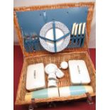 1960s wicker hamper picnic set with four place setting, two sandwich boxes and two flasks