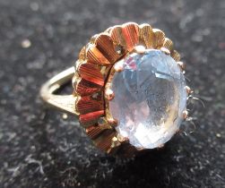 Hallmarked 9ct yellow gold cocktail ring, faceted oval blue stone with engine turned repeating heart