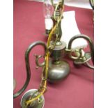 Two three-branch simulated brass finish centre-light fittings with scroll shaped arms