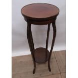 Edwardian mahogany two tier jardinière stand, two graduated tiers on four angular cabriole supports,