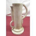 Art Deco period continental plaster jug with stylized handle and spout on circular stepped foot,