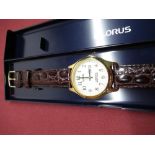 As new Lorus Lumibrite quartz wristwatch with day date, gold plated case on brown leather strap,