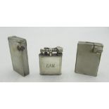 Dunhill Handy lighter, Dunhill double wheel lighter initialled "E A J" and another Dunhill lighter(
