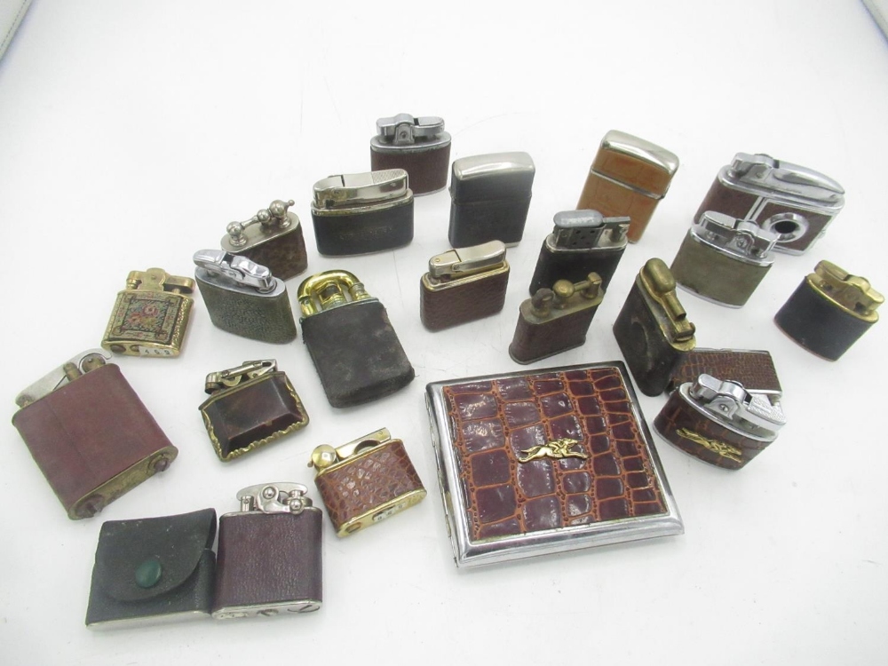 Collection of early 20th century lighters, with leather covering to the majority (21)