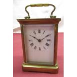 Early C20th French brass cased carriage clock time piece with white enamel dial, bevel edged glass