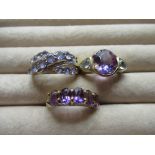 9ct yellow gold dress ring with central lilac stone flanked by two blue stones, size L, 9ct yellow