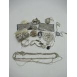 Collection of necklace pendants and brooches, eight sterling silver chains stamped sterling,