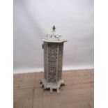 French white enamelled cast iron heater, hexagonal body with colour panels, hinged door and