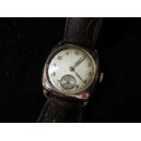 Swiss, 9ct gold cased hand wound wristwatch, silvered dial painted Arabic numerals, rail track