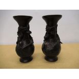 C20th Chinese, pair of bronze baluster vases, with cast entwined dragon, foundry mark to base H15cm