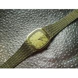 Ladies Omega De Ville hand wound wristwatch, signed matte gold dial with applied baton hour markers,