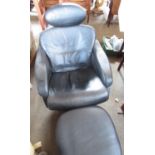 Black leather arm chair with matching foot stool (2)