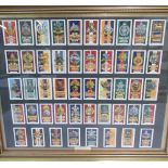 Framed and mounted display of British army regimental cap badge cigarette cards