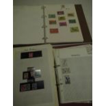Stanley Gibbons International stamp album containing world stamps and another containing British and