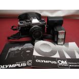 Olympus OM10 camera with 50mm lens and Olympus T20 flashgun in grey carry bag