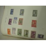 Red Barclay Classic Stamp album containing world stamp including Nigeria, Rhodesia & Nyasaland,