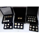 Collection of commemorative and collectable coin and medallion sets with some loose individuals.