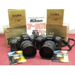 Two Nikon F-601 camera bodies, both with Sigma 28-70mm autofocus lenses, including boxes and