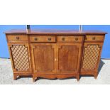 Regency style yew breakfront side cabinet, reeded top and three drawers